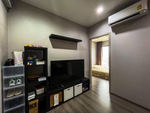 Modern living room with TV and storage shelves