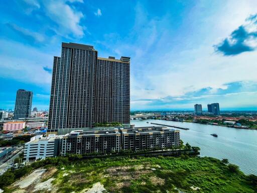 Exterior view of a tall building near a river