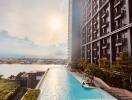 Modern high-rise apartment building with a swimming pool and city view