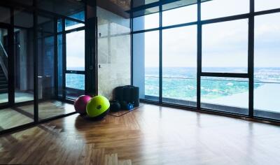 Room with large windows and exercise balls