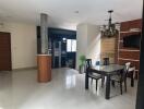 Modern dining room with a table, chairs, and chandelier lighting