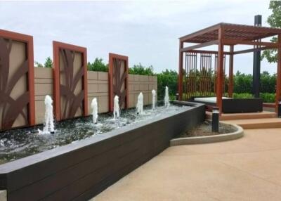 Elegant outdoor feature with water fountains and pergola