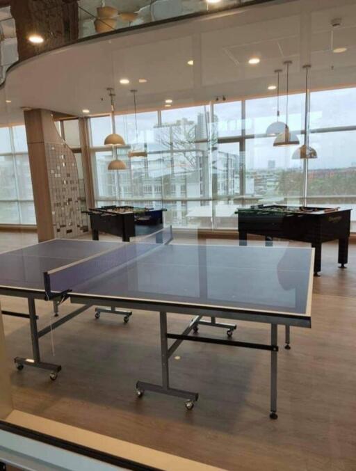 Modern recreation area with table tennis and foosball tables