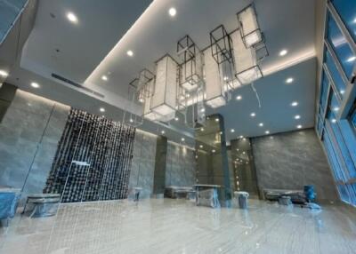 Spacious modern lobby with luxurious lighting and marble flooring
