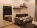 Modern living room with a mirrored wall and a TV unit