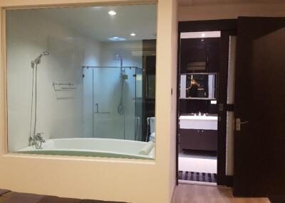 Modern bathroom with bathtub and glass-enclosed shower