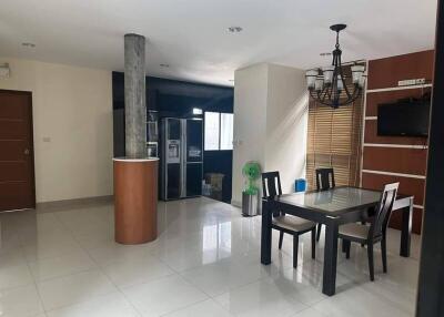 Spacious dining area with adjacent kitchen