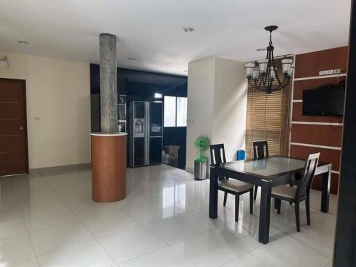 Spacious dining area with adjacent kitchen