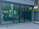 Building with glass doors and outdoor sports court