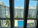 View of building and pool through windows