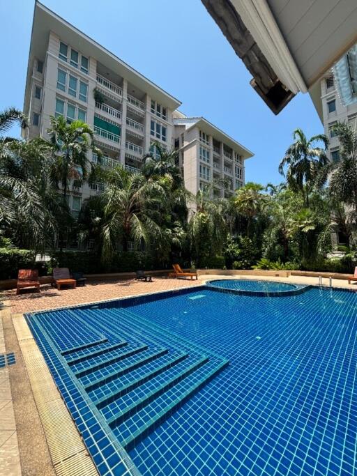 Resort-like apartment complex with a swimming pool