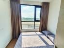 Bright bedroom with large window and double bed
