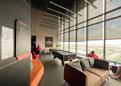 Modern living area with panoramic windows and pool table