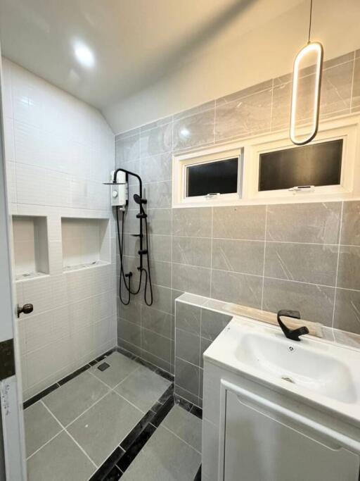 Modern bathroom with shower and vanity