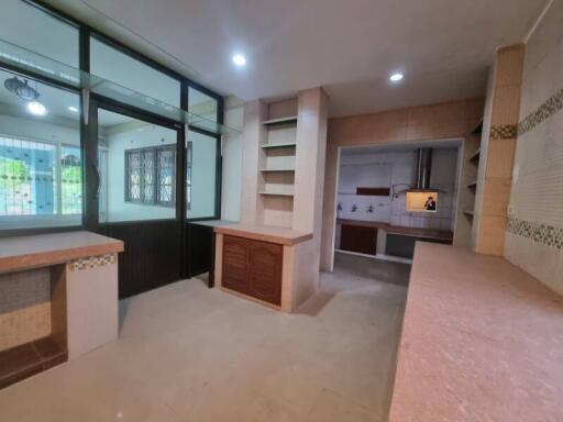 Modern kitchen with ample counter space and built-in shelving