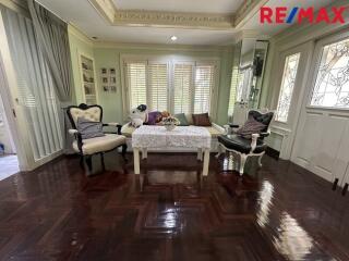 Elegant living room with classic furniture and wooden flooring