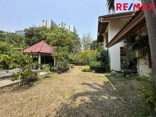 Spacious garden area with gazebo and well-maintained greenery