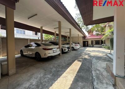 Covered parking area with multiple parked cars