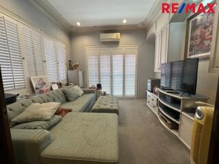 Cozy living room with a sectional couch and entertainment center