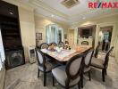 Spacious dining room with a marble table and elegant chairs
