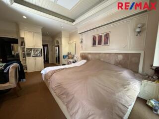Spacious and well-decorated bedroom with ample storage and cozy atmosphere