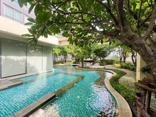 Outdoor swimming pool with a garden