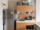 Cozy modern kitchen with refrigerator and cabinets