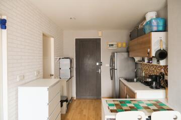 Modern kitchen with appliances and dining area