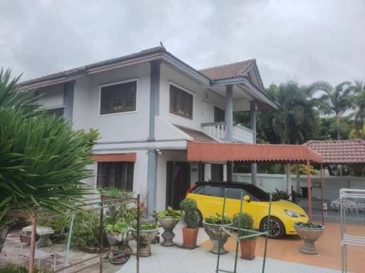 Residential building with garden and covered car park