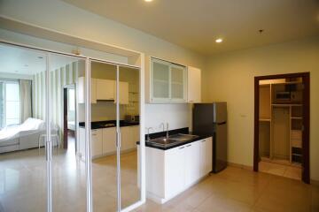 Modern kitchen with sleek white cabinets and stainless steel appliances