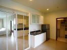 Modern kitchen with sleek white cabinets and stainless steel appliances