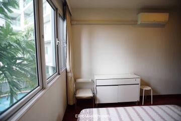 Bedroom with window view and modern furniture