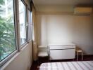 Bedroom with window view and modern furniture