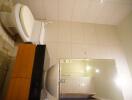 Bathroom with modern fixtures and large mirror