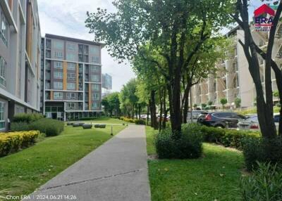 Apartment complex exterior with landscaped garden