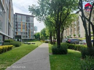 Apartment complex exterior with landscaped garden