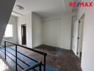 Unfurnished room in a building with staircase view