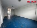 Empty room with blue flooring and white walls