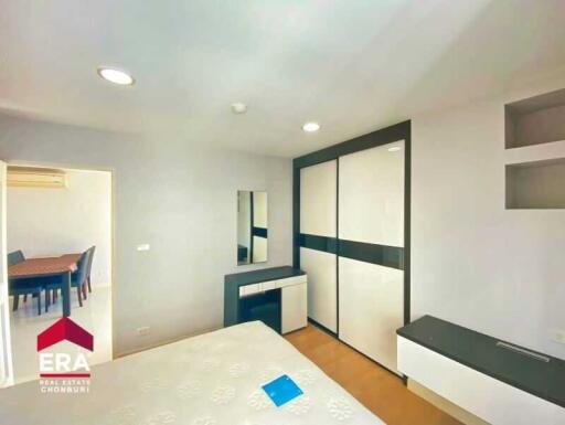Spacious bedroom with built-in wardrobe and vanity