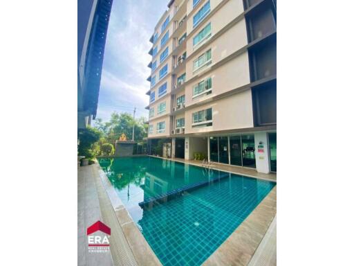 Exterior view of apartment building with swimming pool