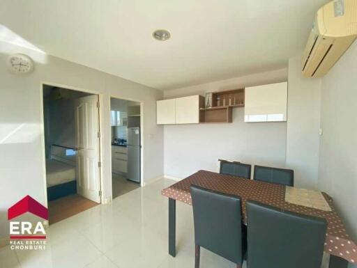 Modern dining area with table, chairs, and air conditioning