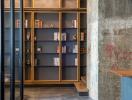 Modern living room with built-in bookshelves and concrete pillar