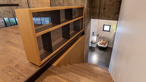 Stairway with modern design leading to a sitting area