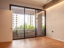 Bedroom with large glass doors leading to a balcony