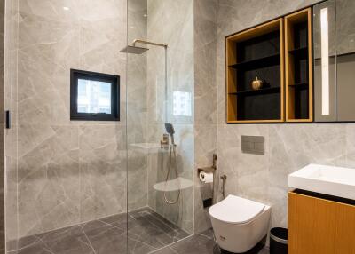 Modern bathroom with glass shower and stylish fixtures