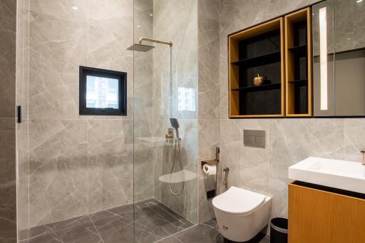 Modern bathroom with glass shower and stylish fixtures