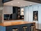 Modern kitchen with wooden island and integrated appliances