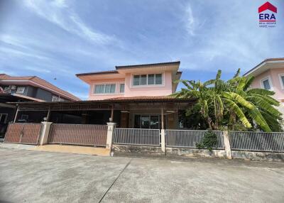 Two-story house with a fenced yard and a covered driveway