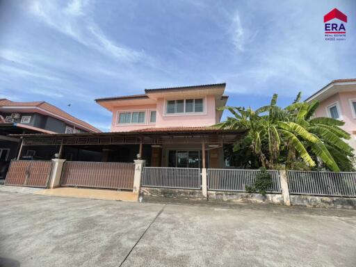 Two-story house with a fenced yard and a covered driveway