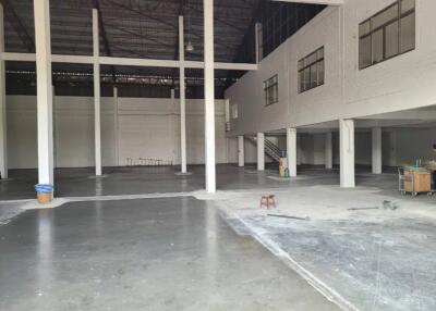 Interior of a large warehouse or industrial building with high ceilings